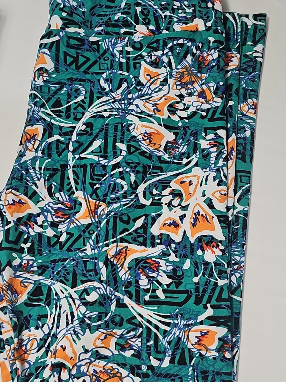 LuLaRoe Teal Floral Print Leggings with Orange and White Accents
